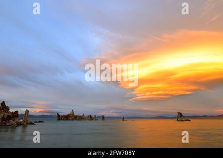 Fantastic colors over Mono Lake with lenticular clouds moving over it at a twilight Stock Photo