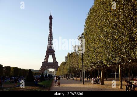 People on the mall of the Eiffel Tower during the early fall. Pars, France. Stock Photo