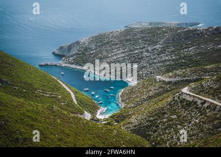 Porto Vromi. Ionian sea bay with moored and anchored boats. Zakynthos island sightseeing spot. Greece Stock Photo