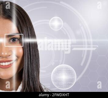 Eye scanning of asian young woman by laser light over the digital virtual technology background, vision and identification concept Stock Photo