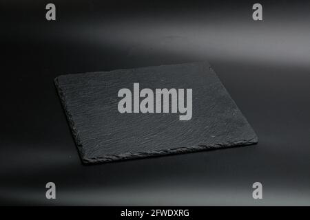 Black stone table plate for kitchen isolated Stock Photo