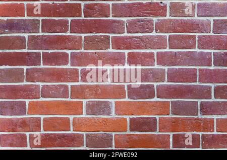 Red rustic brick wall - high quality texture. Background for your projects and creative work. Stock Photo