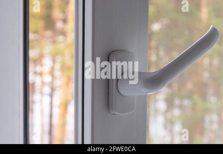open plastic window on a forest background Stock Photo