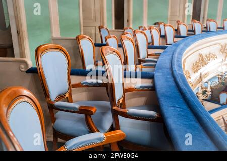 Rows  empty chairs of seats  in the cinema, theater, auditorium, conference hall, congress, parliament, court.  Presentation of a conference, opera. Stock Photo
