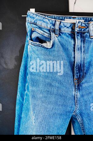 Blue men or women  jeans denim pants. Contrast saturated color. Fashion clothing concept. Stock Photo