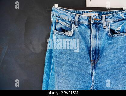 Blue men or women  jeans denim pants. Contrast saturated color. Fashion clothing concept. Stock Photo