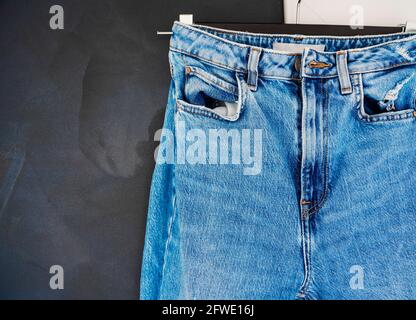 Blue mens or women jeans denim pants. Contrast saturated color. Fashion clothing concept. View from above Stock Photo