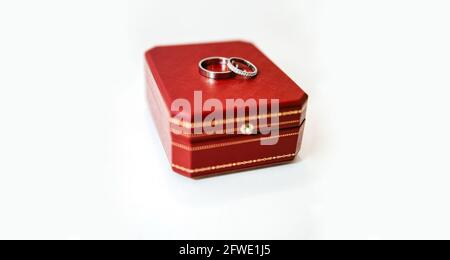 Engagement Wedding Rings in white gold and diamonds on a red box. Stock Photo