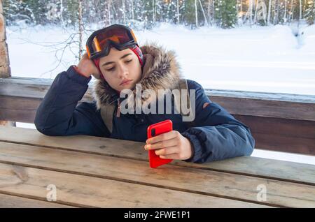 Young teenage man using smartphone taking a selfie for his profile. Stock Photo