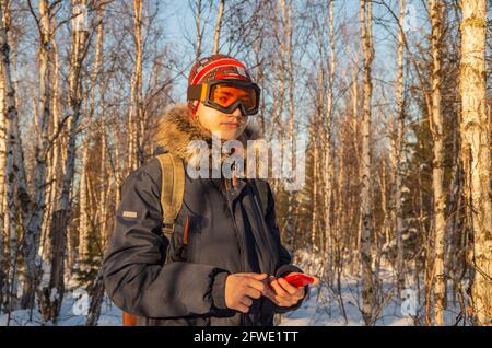 Young teenage man using smartphone for video call Stock Photo