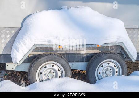 Car Tires on a snow-covered winter road Stock Photo