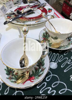 Elegant Christmas table setting design captured from above. Empty plates, glass, cutlery and decorations. Background layout Stock Photo
