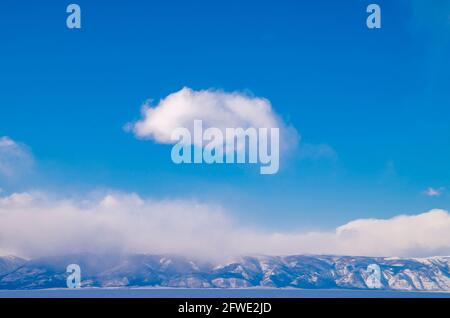 Blue sky with close-up white fluffy and tiny clouds background and pattern. Stock Photo