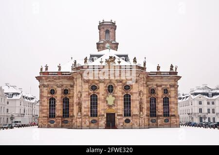 Ludwigskirche and Ludwigsplatz square under the snow, Saarbrucken, Saarland, Germany Stock Photo