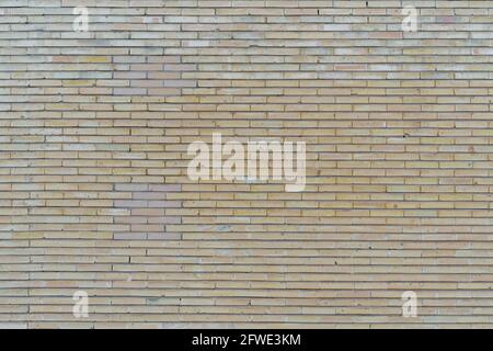 Brick-wall pattern in yellow, wallpaper, background. Stock Photo