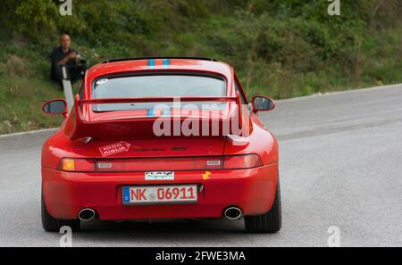 CAGLI , ITALY - OTT 24 - 2020 : PRSCHE CARRERA LIVREA MARTINI on an old racing car in rally Mille Miglia 2020 the famous italian historical race (1927 Stock Photo