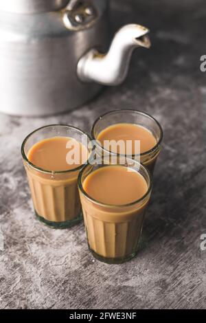 Indian chai in glass cups with metal kettle and other masalas to make the  tea Stock Photo - Alamy