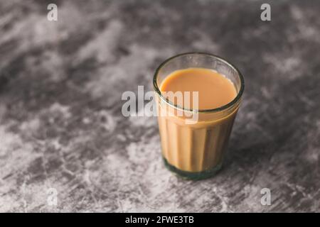 https://l450v.alamy.com/450v/2fwe3tb/indian-chai-in-glass-cups-with-metal-kettle-and-other-masalas-to-make-the-tea-2fwe3tb.jpg