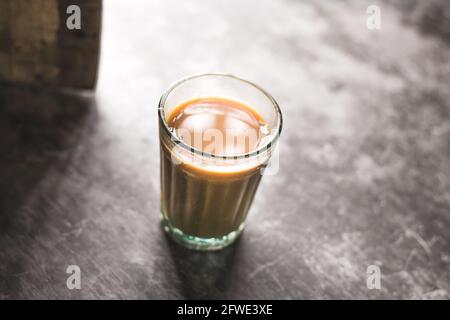 https://l450v.alamy.com/450v/2fwe3xe/indian-chai-in-glass-cups-with-metal-kettle-and-other-masalas-to-make-the-tea-2fwe3xe.jpg