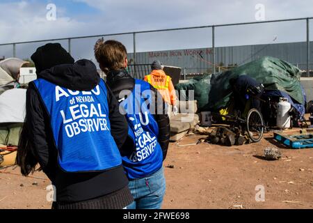 Reno, United States. 20th May, 2021. American Civil Liberties Union (ACLU) legal observers monitor the sweep following the establishment of a newly opened shelter. After nearly a year a large homeless camp is cleared by the city. Homeless individuals were directed to a newly opened shelter. These sweeps will continue in the coming weeks. Credit: SOPA Images Limited/Alamy Live News Stock Photo