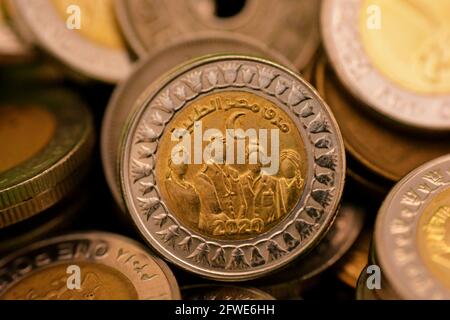 A slogan of Egypt’s Medical Staff 2020 on the reverse side of Egyptian one pound coin In appreciation of the Egyptian medical staff efforts COVID-19 Stock Photo