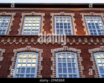 wall of restored old building of former bolshevik factory in Moscow city in evening Stock Photo
