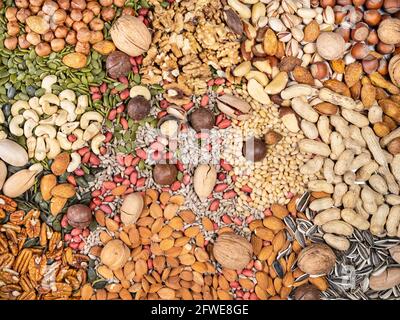 top view of various colorful nuts and seeds on table Stock Photo