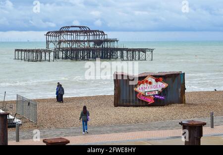 Brighton UK 22nd May 2021 - The old shipping container which has appeared on Brighton beach to promote the new Netflix film 'Army of the Dead' on a dull unseasonably cool morning along the South Coast  : Credit Simon Dack / Alamy Live News Stock Photo