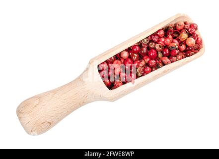 top view of pink peppercorns (Baie rose) in wood scoop cutout on white background Stock Photo