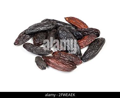 pile of dried tonka beans closeup on white background Stock Photo