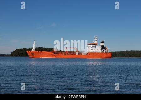 Orange oil/chemical tanker leaving Naantali oil refinery and passing Ruissalo island.