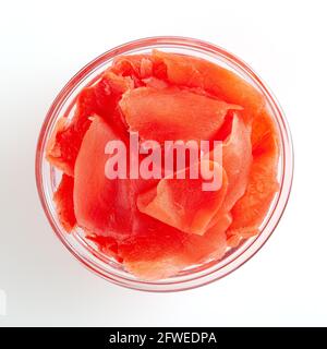 Red pickled ginger in glass bowl isolated on white background with clipping path Stock Photo