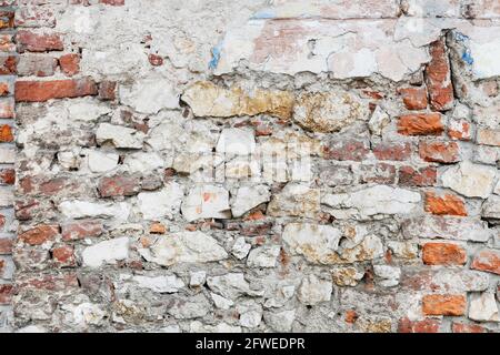 Damaged brick and stone wall. Graphic resources Stock Photo