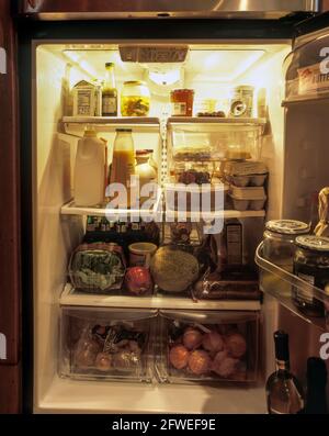 2006 HISTORICAL OPEN DOOR OF REFRIGERATOR FULL OF FOOD (©ELECTROLUX 2005) Stock Photo