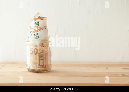 euro money banknotes in the glass ja. Business concept. Money savings in glass pot Stock Photo