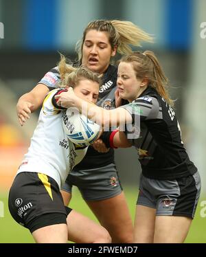 York City Knights' Bethany Lambert (left) is tackled by Castleford Tigers' Lucy Eastwood (right) during the Women's Challenge Cup semi final match at the LNER Stadium, York. Picture date: Saturday May 22, 2021. Stock Photo