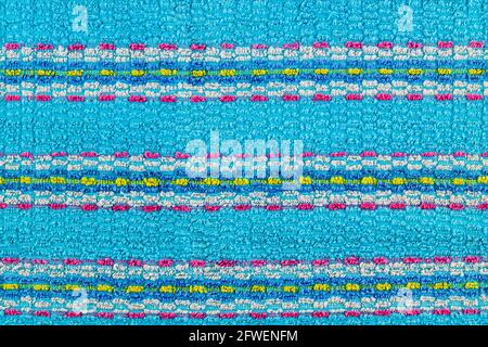 old turquoise blue towel with horizontal stripes ornament - flat background and seamless texture Stock Photo