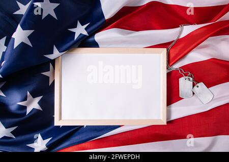 USA Memorial Day concept. Empty frame for text and American flag. Military dog tags. Stock Photo