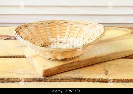 Empty wicker basket on wooden table. Graphic resources Stock Photo