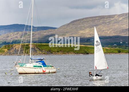 Bantry, West Cork, Ireland. 22nd May, 2021. The sun shone on Bantry this morning with many locals and visitors taking full advantage of the good weather. Bantry Bay Sailing Club's Saturday morning sailing session attracted many sailors. Enjoying a morning's sailing was club member Conor Hinnell. Credit: AG News/Alamy Live News Stock Photo