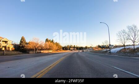 Driving on typical paved roads in suburban America. Stock Photo