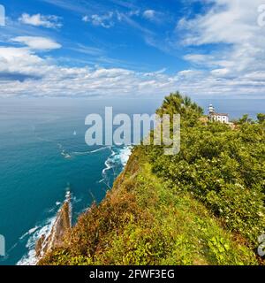 Getaria Lighthouse is located at the end Getaria Mouse (symbol of town), on Mount San Anton. Spain, Basque Country. Stock Photo