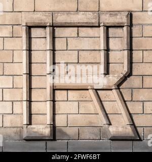 Large letter R composed of light clinker Stock Photo