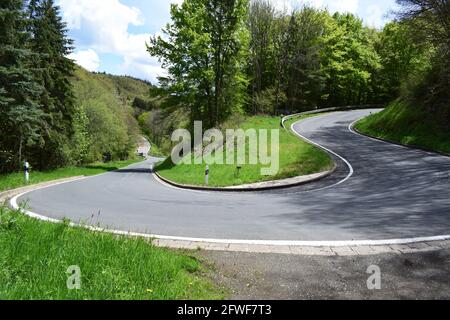 twisted Eifel road in spring Stock Photo
