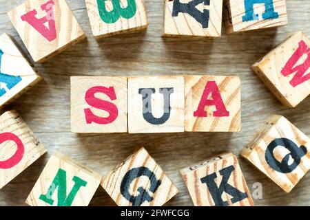 Alphabet letter block in word SUA (Abbreviation of Single use account) with another on wood background Stock Photo