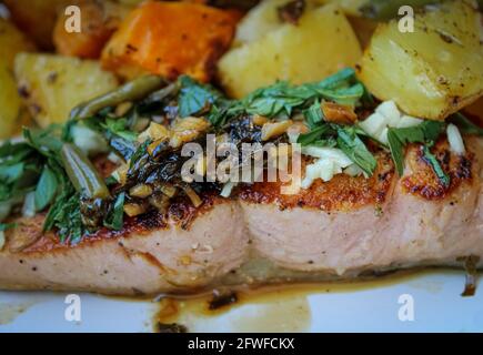 Grilled salmon with baked potatoes and vegetables Stock Photo