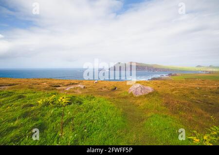 Scenic coastal seascape and landscape view from Ceann Sreatha on Waymont headland of Clogher Strand bay beach on the Dingle Peninsula, Ireland. Stock Photo