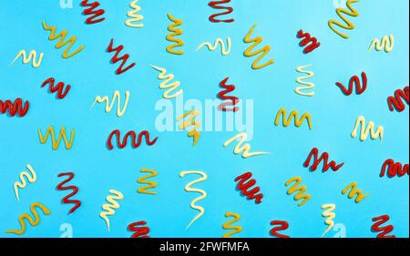 Ketchup mayonnaise and mustard sauce swirl pattern on light blue background Stock Photo