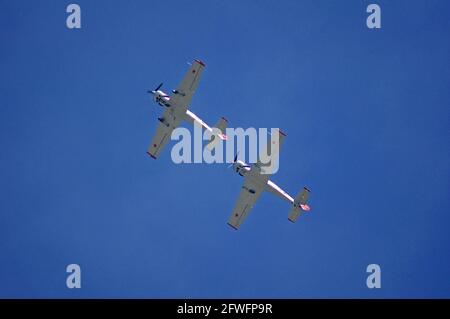 Yakovlevs Aerobatic Display Team at Lifeboat Launch Day Selsey West Sussex England UK Russian designed aircraft know as Yak 52 or Super 52 Two seater Stock Photo