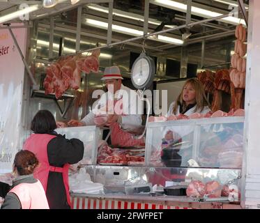 Woman buying meat, butcher's stall at market, Otavalo, Imbabura ...